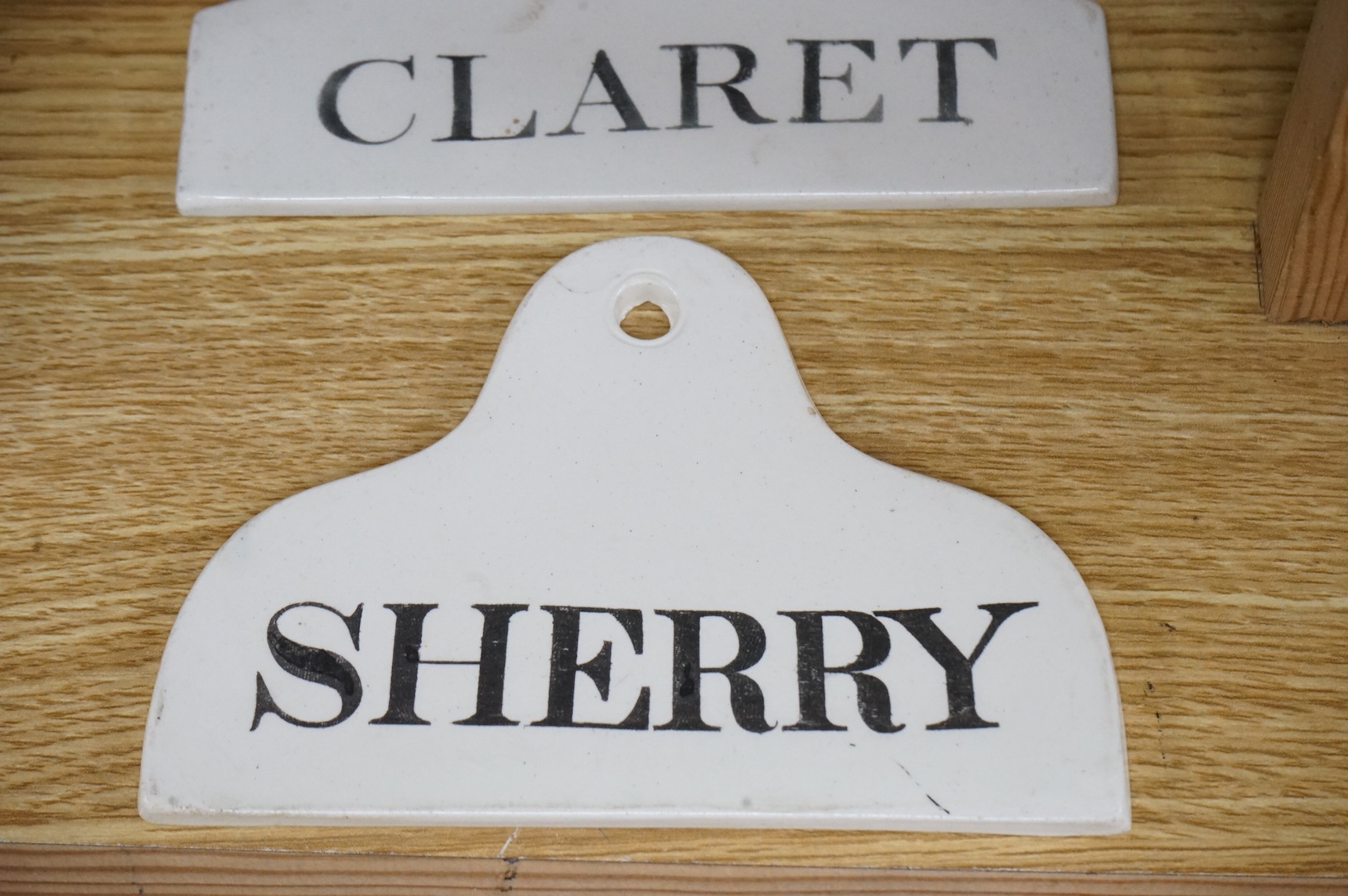 Two Creamware Claret labels, 14.4cm wide and a similar Sherry label, c.1820